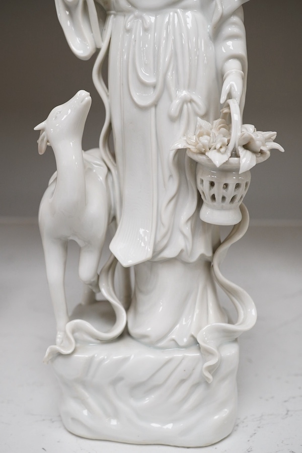 A Chinese blanc de chine figure of Guanyin with a deer, 32cm high. Condition - good